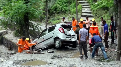 NDRF team trying to retrieve car following a cloudburst in Rampur area of Shimla district. (PTI) NDRF team trying to retrieve car following a cloudburst in Rampur area of Shimla district. (PTI)