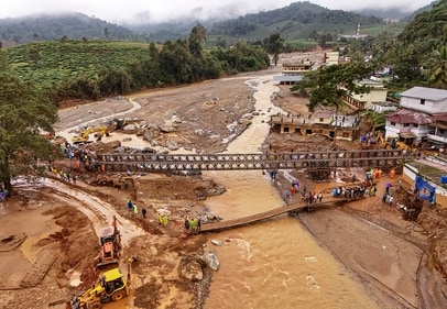 Army personnel during the construction of a bailey bridge at Chooralmala area as part of a rescue operation after a recent landslide triggered by heavy rainfall, in Wayanad district, Thursday, Aug. 1, 2024. (PTI) Army personnel during the construction of a bailey bridge at Chooralmala area as part of a rescue operation after a recent landslide triggered by heavy rainfall, in Wayanad district, Thursday, Aug. 1, 2024. (PTI)