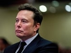 Tesla CEO and X owner Elon Musk listens as US President-elect Donald Trump speaks during a meeting with House Republicans at the Hyatt Regency hotel in Washington, DC, U.S. on November 13, 2024. 