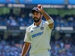 India's Jasprit Bumrah holds up the ball as he leaves the field after taking the five wickets during play on the last day of the fourth cricket Test against Australia. India's Jasprit Bumrah holds up the ball as he leaves the field after taking the five wickets during play on the last day of the fourth cricket Test against Australia.