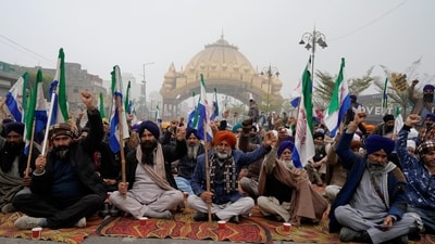 Farmers raise slogans as they block a road during the statewide 'bandh' called as part their ongoing protest, near Golden Gate, in Amritsar on Monday. (PTI) Farmers raise slogans as they block a road during the statewide 'bandh' called as part their ongoing protest, near Golden Gate, in Amritsar on Monday. (PTI)