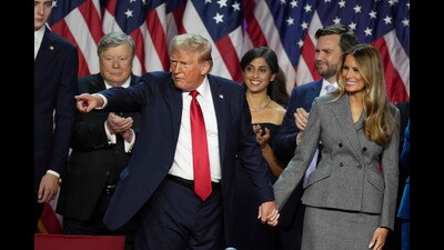 President-elect Donald Trump holds hands with Melania Trump after speaking to supporters at the Palm Beach County Convention Center during an election night watch party, Wednesday, Nov. 6, 2024, in West Palm Beach, Fla. (AP Photo/Lynne Sladky) (AP)