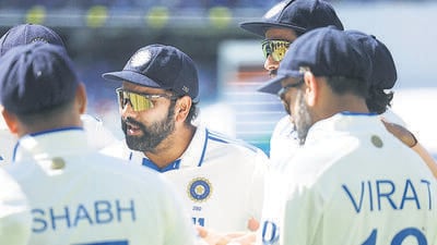 Rohit Sharma during a huddle before play on day five of the fourth Test at the Melbourne Cricket Ground (MCG). (AFP) Rohit Sharma during a huddle before play on day five of the fourth Test at the Melbourne Cricket Ground (MCG). (AFP)