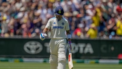 India's Virat Kohli walks off the field after losing his wicket during play on the last day of the fourth cricket Test between Australia and India at the Melbourne Cricket Ground. (AP)
