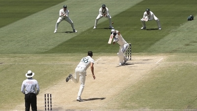 Australia's Usman Khawaja (top 2nd R) takes a catch to dismiss India's Virat Kohli on day five of the fourth Test match between Australia and India at the Melbourne Cricket Ground. (AFP)