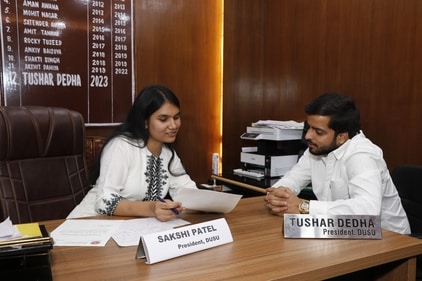 Former DUSU President with one among the 10 female students who were selected to play his role on campus for a day. Former DUSU President with one among the 10 female students who were selected to play his role on campus for a day.