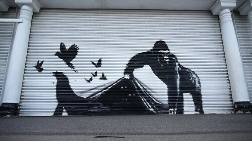 This artwork by street artist Banksy was the ninth one to release in nine days, and depicted a gorilla releasing animals on the front of a shutter outside the London Zoo. (Photo: AFP) This artwork by street artist Banksy was the ninth one to release in nine days, and depicted a gorilla releasing animals on the front of a shutter outside the London Zoo. (Photo: AFP)