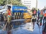 Brihanmumbai Municipal Corporation (BMC) workers clean roads to curb air pollution, at Churchgate in Mumbai Brihanmumbai Municipal Corporation (BMC) workers clean roads to curb air pollution, at Churchgate in Mumbai