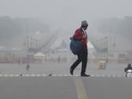 People are seen at Kartavya Path during foggy and Cold morning in New Delhi, People are seen at Kartavya Path during foggy and Cold morning in New Delhi,