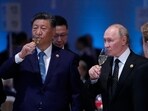 Russian President Vladimir Putin and Chinese President Xi Jinping hold glasses during a festive reception of the BRICS summit in Russia. (AP File Photo)