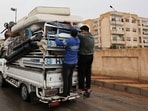 Families of former soldiers and officers of Assad's regime army board a truck with their belongings  as they leave their homes in officer housing on the outskirts of Damascus following evacuation orders from factions of Hay’at Tahrir al-Sham (HTS), after Syria's Bashar al-Assad was ousted, in Syria, December 29, 2024.