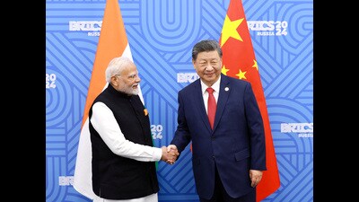 FILE PHOTO: Chinese President Xi Jinping and India Prime Minister Narendra Modi meet on the sidelines of the BRICS summit in Kazan, Russia October 23, 2024. China Daily via REUTERS (VIA REUTERS) FILE PHOTO: Chinese President Xi Jinping and India Prime Minister Narendra Modi meet on the sidelines of the BRICS summit in Kazan, Russia October 23, 2024. China Daily via REUTERS (VIA REUTERS)