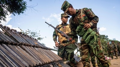 Members of Ta'ang National Liberation Army (TNLA) received military equipments at a graduation ceremony after getting special combat training for three months in a secret jungle near Namhkam, Myanmar's northern Shan State. The Ta'ang National Liberation Army (TNLA), a major Myanmar ethnic rebel group said on November 25, 2024 that it was ready for talks with the junta to end more than a year of renewed fighting that has ravaged areas along the China border. (AFP) Members of Ta'ang National Liberation Army (TNLA) received military equipments at a graduation ceremony after getting special combat training for three months in a secret jungle near Namhkam, Myanmar's northern Shan State. The Ta'ang National Liberation Army (TNLA), a major Myanmar ethnic rebel group said on November 25, 2024 that it was ready for talks with the junta to end more than a year of renewed fighting that has ravaged areas along the China border. (AFP)