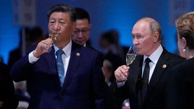 Russian President Vladimir Putin and Chinese President Xi Jinping hold glasses during a festive reception of the BRICS summit in Russia. (AP File Photo) Russian President Vladimir Putin and Chinese President Xi Jinping hold glasses during a festive reception of the BRICS summit in Russia. (AP File Photo)