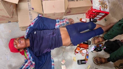 A viral photo shows the thief sprawled on the floor of a wine shop, passed out after indulging in a few drinks. (X) A viral photo shows the thief sprawled on the floor of a wine shop, passed out after indulging in a few drinks. (X)