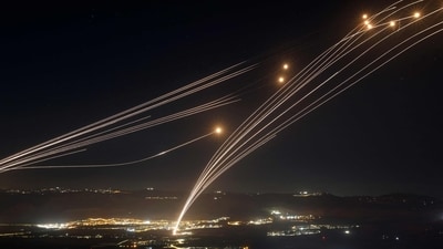 Rockets fired from southern Lebanon are intercepted by Israel's Iron Dome air defence system over the Upper Galilee region in northern Israel, on August 4, 2024, amid ongoing cross-border clashes between Israeli troops and Lebanon's Hezbollah fighters.. Middle East tensions soared as Iran and its allies readied their response to the assassination of Hamas's political leader, blamed on Israel, spurring fears of a regional war. (AFP) Rockets fired from southern Lebanon are intercepted by Israel's Iron Dome air defence system over the Upper Galilee region in northern Israel, on August 4, 2024, amid ongoing cross-border clashes between Israeli troops and Lebanon's Hezbollah fighters.. Middle East tensions soared as Iran and its allies readied their response to the assassination of Hamas's political leader, blamed on Israel, spurring fears of a regional war. (AFP)