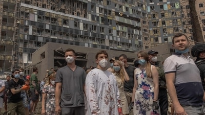 Ukrainian doctor Ihor Kolodka (C) stands amid the rubble of the destroyed building of Ohmatdyt Children's Hospital following a Russian missile attack, in the Ukrainian capital of Kyiv on July 8, 2024, amid the Russian invasion in Ukraine.. Russia launched more than 40 missiles at several cities across Ukraine on July 8, 2024 in an attack that killed at least 20 people and smashed into a children's hospital in Kyiv, officials said. (AFP) Ukrainian doctor Ihor Kolodka (C) stands amid the rubble of the destroyed building of Ohmatdyt Children's Hospital following a Russian missile attack, in the Ukrainian capital of Kyiv on July 8, 2024, amid the Russian invasion in Ukraine.. Russia launched more than 40 missiles at several cities across Ukraine on July 8, 2024 in an attack that killed at least 20 people and smashed into a children's hospital in Kyiv, officials said. (AFP)