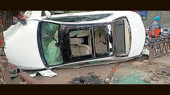 The Mercedes (CH-01-CH-0533) jumped the divider and hit the second deliveryman before overturning. (HT Photo)