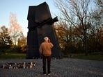 A man visits a memorial to the victims of the 9/11 attacks on the World Trade Center in New York, and the victims of terrorist attacks around the world during All Saints' Day, a holiday to remember deceased loved ones, in Kielce on November 1, 2024.(Photo by Sergei GAPON / AFP) A man visits a memorial to the victims of the 9/11 attacks on the World Trade Center in New York, and the victims of terrorist attacks around the world during All Saints' Day, a holiday to remember deceased loved ones, in Kielce on November 1, 2024.(Photo by Sergei GAPON / AFP)