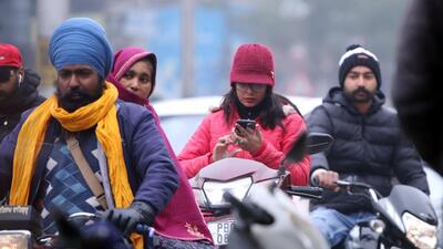 Commuters brave the cold , wrapped in warm clothes, on a cold winter day in Bathinda on Wednesday. (Sanjeev Kumar/Hindustan Times)