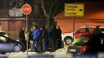 Police and security personnel stand near the scene where a gunman opened fire at a restaurant and killed several people in Cetinje, Montenegro, January 1, 2025. (Reuters)