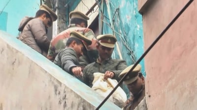 Police personnel during an investigation after five members of a family were found dead inside a hotel in Lucknow, on Wednesday. (PTI) Police personnel during an investigation after five members of a family were found dead inside a hotel in Lucknow, on Wednesday. (PTI)