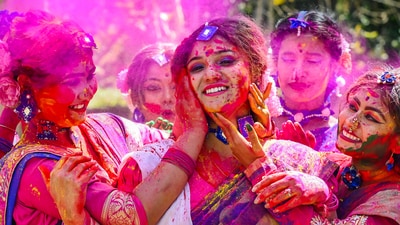 Women play with colours ahead of the festival of Holi, in Nadia, March 11, 2024. (PTI) Women play with colours ahead of the festival of Holi, in Nadia, March 11, 2024. (PTI)