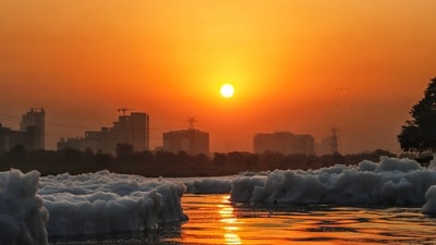New Delhi: Toxic foam floats on the surface of the polluted Yamuna river, during sunrise, at Kalindi Kunj, Oct. 15, 2024. (PTI) New Delhi: Toxic foam floats on the surface of the polluted Yamuna river, during sunrise, at Kalindi Kunj, Oct. 15, 2024. (PTI)
