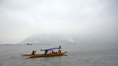 Tourists enjoying shikara boat ride on a frozen surface of Dal Lake in Srinagar on Wednesday. (Waseem Andrabi /HT) Tourists enjoying shikara boat ride on a frozen surface of Dal Lake in Srinagar on Wednesday. (Waseem Andrabi /HT)