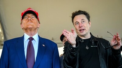 FILE - President-elect Donald Trump listens to Elon Musk as he arrives to watch SpaceX's mega rocket Starship lift off for a test flight from Starbase in Boca Chica, Texas, Nov. 19, 2024. (Brandon Bell/Pool via AP, File) (AP)