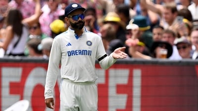 India's Virat Kohli gestures to the crowd on the second day of the fourth cricket Test match between Australia and India at the Melbourne Cricket Ground. (AFP) India's Virat Kohli gestures to the crowd on the second day of the fourth cricket Test match between Australia and India at the Melbourne Cricket Ground. (AFP)