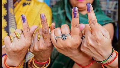 Voters show their fingers marked with indelible ink after casting votes for the third phase of Lok Sabha elections, in Hathras, Uttar Pradesh, in May 7, 2024. (PTI)