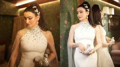 Shalini Passi stuns in a white gown paired with a crystal dove bag. Shalini Passi stuns in a white gown paired with a crystal dove bag.