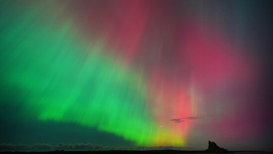 The Northern Lights seen in an incredible display in the skies over Lindisfarne Castle in Northumberland (Owen Humphreys/PA)