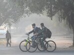 Students on their way to school amid rising air pollution in Noida. Students on their way to school amid rising air pollution in Noida.