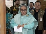 Bangladesh Prime Minister Sheikh Hasina checks her watch as she waits for the official opening time to cast her vote in Dhaka, Bangladesh, Jan. 7, 2024. (AP) Bangladesh Prime Minister Sheikh Hasina checks her watch as she waits for the official opening time to cast her vote in Dhaka, Bangladesh, Jan. 7, 2024. (AP)