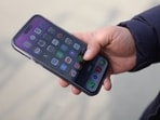 An Iranian man looks at his mobile phone after the ban on WhatsApp and Google Play was lifted.