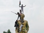 A file photo of protesters atop the statue of Sheikh Mujibur Rahman at the Bijoy Sarani area, as they celebrate the resignation of the Prime Minister Sheikh Hasina in Dhaka on August 5.