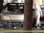 The remains of a Tesla Cybertruck that burned at the entrance of Trump Tower, are inspected in Las Vegas, Nevada, U.S. January 1, 2025.  REUTERS