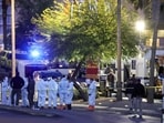First responders, some wearing Hazmat gear, gather outside the Fashion Show mall across from the Trump International Hotel & Tower Las Vegas as they investigate a Tesla Cybertruck that exploded in front of the hotel's entrance on January 01, 2025 in Las Vegas, Nevada (Photo by Ethan Miller / GETTY IMAGES NORTH AMERICA / Getty Images via AFP) First responders, some wearing Hazmat gear, gather outside the Fashion Show mall across from the Trump International Hotel & Tower Las Vegas as they investigate a Tesla Cybertruck that exploded in front of the hotel's entrance on January 01, 2025 in Las Vegas, Nevada (Photo by Ethan Miller / GETTY IMAGES NORTH AMERICA / Getty Images via AFP)