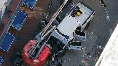 A black flag with white lettering lies on the ground rolled up behind a pickup truck that a man drove into a crowd on Bourbon Street in New Orleans, killing and injuring a number of people, early Wednesday morning, Jan. 1, 2025. The FBI said they recovered an Islamic State group flag, which is black with white lettering, from the vehicle. (AP) A black flag with white lettering lies on the ground rolled up behind a pickup truck that a man drove into a crowd on Bourbon Street in New Orleans, killing and injuring a number of people, early Wednesday morning, Jan. 1, 2025. The FBI said they recovered an Islamic State group flag, which is black with white lettering, from the vehicle. (AP)