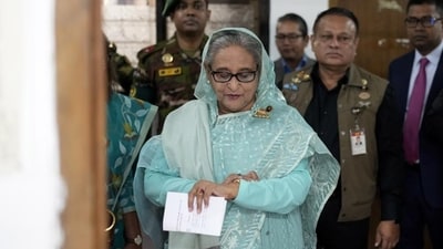 Bangladesh Prime Minister Sheikh Hasina checks her watch as she waits for the official opening time to cast her vote in Dhaka, Bangladesh, Jan. 7, 2024. (AP) Bangladesh Prime Minister Sheikh Hasina checks her watch as she waits for the official opening time to cast her vote in Dhaka, Bangladesh, Jan. 7, 2024. (AP)