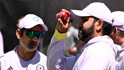 Indian coach Gautam Gambhir (L) and captain Rohit Sharma (R) chat in the nets at the Melbourne Cricket Ground (MCG) in Melbourne -- (AFP) Indian coach Gautam Gambhir (L) and captain Rohit Sharma (R) chat in the nets at the Melbourne Cricket Ground (MCG) in Melbourne -- (AFP)