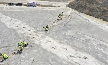 Work underway as five extensive trackways that formed part of a “dinosaur highway” are uncovered, at Dewars Farm Quarry in Oxfordshire, England. (AP) Work underway as five extensive trackways that formed part of a “dinosaur highway” are uncovered, at Dewars Farm Quarry in Oxfordshire, England. (AP)