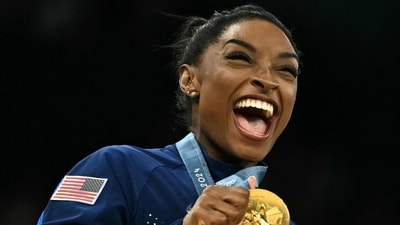 Simone Biles, awarded Sports Illustrated’s Sportsperson of the Year, highlights her Olympic triumphs and the mental health challenges athletes face. (Photo by Lionel BONAVENTURE / AFP) (AFP) Simone Biles, awarded Sports Illustrated’s Sportsperson of the Year, highlights her Olympic triumphs and the mental health challenges athletes face. (Photo by Lionel BONAVENTURE / AFP) (AFP)