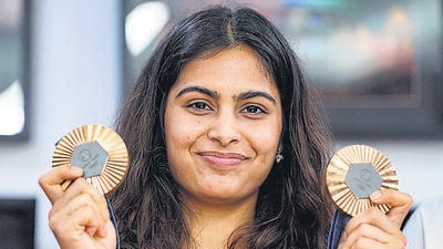 Paris Olympics bronze medallist shooter Manu Bhaker poses with her medals, in New Delhi. (PTI) Paris Olympics bronze medallist shooter Manu Bhaker poses with her medals, in New Delhi. (PTI)
