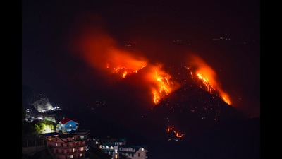 Shimla: Flames billow out after a fire broke out in a forest near residential area, in Shimla, on Sunday night, May 26, 2024. (PTI Photo) (PTI) Shimla: Flames billow out after a fire broke out in a forest near residential area, in Shimla, on Sunday night, May 26, 2024. (PTI Photo) (PTI)