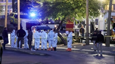 First responders, some wearing Hazmat gear, gather outside the Fashion Show mall across from the Trump International Hotel & Tower Las Vegas as they investigate a Tesla Cybertruck that exploded in front of the hotel's entrance on January 01, 2025 in Las Vegas, Nevada (Photo by Ethan Miller / GETTY IMAGES NORTH AMERICA / Getty Images via AFP) (Getty Images via AFP) First responders, some wearing Hazmat gear, gather outside the Fashion Show mall across from the Trump International Hotel & Tower Las Vegas as they investigate a Tesla Cybertruck that exploded in front of the hotel's entrance on January 01, 2025 in Las Vegas, Nevada (Photo by Ethan Miller / GETTY IMAGES NORTH AMERICA / Getty Images via AFP) (Getty Images via AFP)