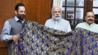 Prime Minister Narendra Modi hands over a Chaadar to be offered at Dargah Khwaja Moinuddin Chishti in Ajmer. (PTI FILE PHOTO)