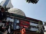 People walk past the Bombay Stock Exchange (BSE) building in Mumbai, India, March 9, 2020